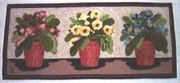 A hooked rug made by a modern craftsperson in Lebanon, New Hampshire, USA. Rug hooking was originally developed in England as a method of using leftover scraps of cloth.